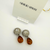 Giorgio Armani Strass Clip Oorbellen met Amberkleurige Hanger