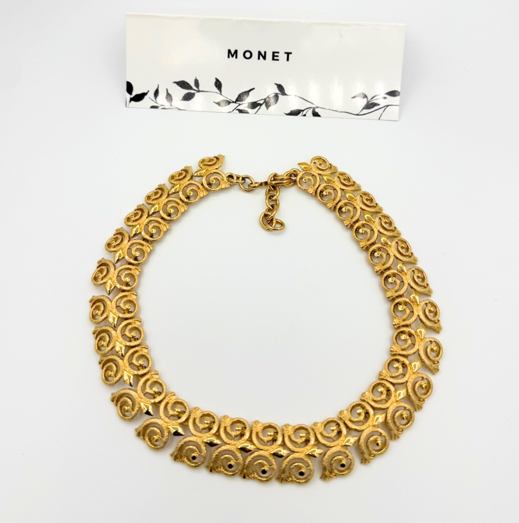 Vintage Monet statement-collier in goudtint met rozetten
